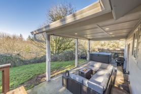 Beautiful like new home with a large hot tub in a quiet neighborhood on Acreage.