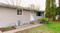Fantastic Oasis Home in Stevens Point with fully enclosed fence for backyard!