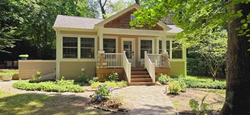 Bright Scandinavian-style cottage with large, private wooded yard