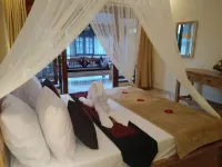 Qiul Guest House Hoteles cerca de Museo de Arte Angung Rai (ARMA