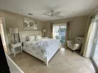 Intracoastal 🌴 Waterfront Pool Home, Walk to Beach, Heated Pool, Sit on Dock