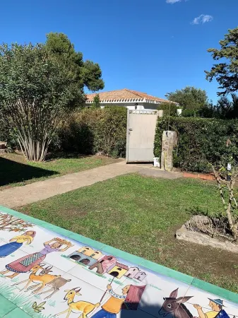 Villa with large garden a few steps from the beautiful beach of Costa Rei Отели в г. Costa Rei