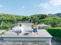Denpaku Umimiru Yane No Yado <Amamioshima> فنادق في سيتوتشي