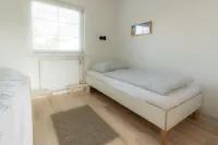Spacious vacation apartment with garden, surrounded by greenery.