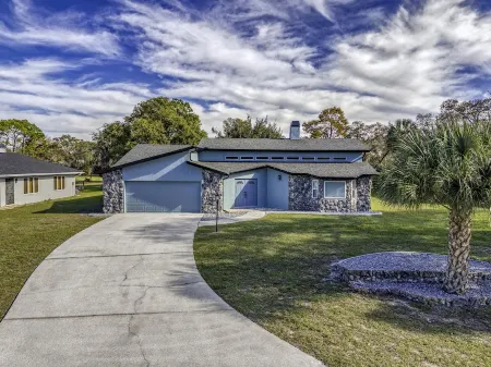 Four Beds, three baths, heated pool, and a Golf Course. What more do you need!!