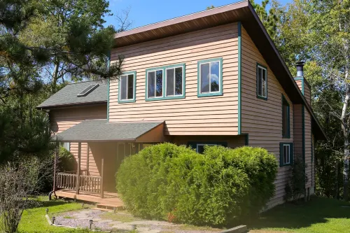 Lakeside cabin with Hot Tub and full kitchen!  Sleeps up to 12 people.