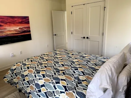 Beautiful new contemporary home, quiet wooded lot minutes from Devils Lake