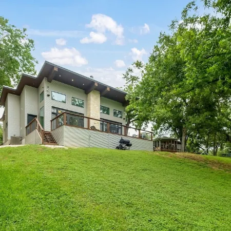 Modern River Home on 1/2 Acre with 101' of Private River Frontage.