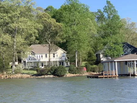 Spectacular Main Lake Sunsets from spacious 4 BR, 3800 sq ft, 1-acre point lot