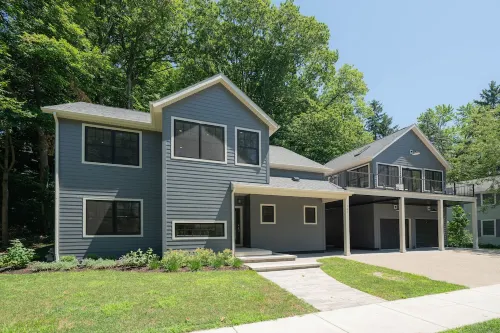 AMAZING NEWER HOME WITH LAKE VIEWS, steps away from shops and restaurants.