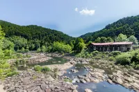 Scenic Grounds with Cozy Cabins and Stocked Pond - Charming Escape