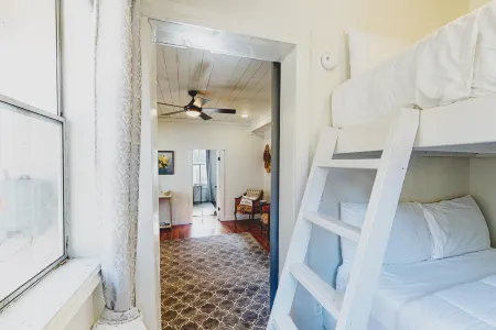 Lower-level dog-friendly home with a porch, AC, parking & washer/dryer