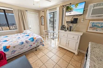 Private Balcony and Sparkling Pool - Charming Coastal Retreat Hotels near Beach Bookshop & Video