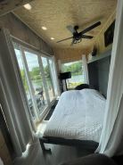 Unplug and unwind in this charming loft cabin nestled on the water’s edge.