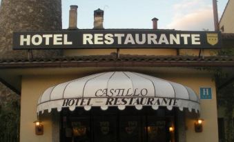 "a building with a large white awning and a sign that reads "" hotel restaurant "" on the front" at Hotel Castillo