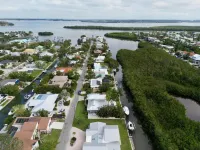 Cute canal front Cottage with dock & boat lift and pool ,short walk to the beach