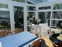 Honeysuckle Cottage with optional hot tub and shared EV charger.