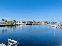 Water Front Home with Heated Pool & Hot Tub, 2 Master Suites & a Floating Dock.