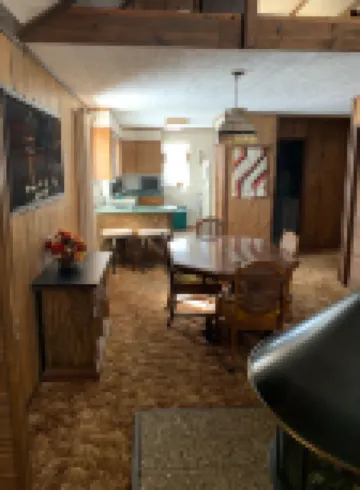 Cozy vacation home nestled in a quiet wooded area. Near town but private