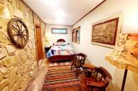 Robin's Nest is an authentic log cabin built with hand-hewn logs from the 1800's