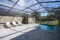Contemporary 4BR Getaway Minutes From Disney Hotel di Four Corners