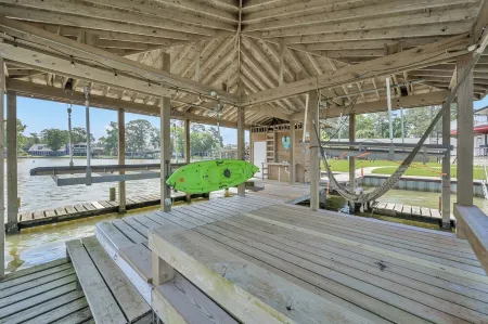 Waterfront Lighthouse with Large Dock for a Great Family Getaway