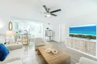 Coastal Escape • Walk to Beach • Gym •  Pool • Hot Tub