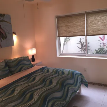 Quiet and serene ocean front 2-bedroom 2-bathroom condo, steps from the sand!