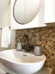 Live in this iconic East Side lower level apartment