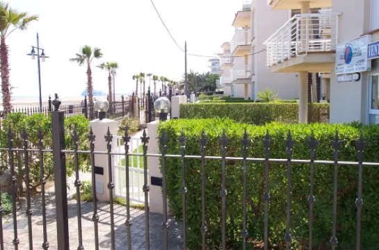 Apartment on the beachfront with pool and parking