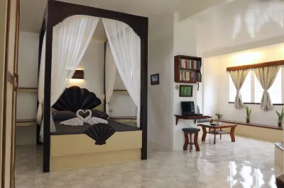 Guindulman Bay Tourist Inn Hotels near RAJ Shopping Center