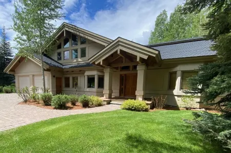 Ski bus stops at front door, court sports and indoor game room, bike path