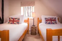 Chocolate-box pretty Pear Tree Cottage in South Downs village