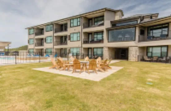 Lake front Condo 2BD/2BA w/ pool, hot tub, fire pit, gas grills, gym, & laundry.