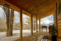Cozy Log Cabin located on scenic acreage with trees and privacy.