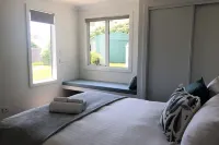 Beach House with Bay of Fires views, featuring 2 bedrooms with ensuite bathrooms
