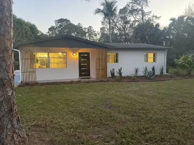 Midcentury Rambler with large backyard and open patio.