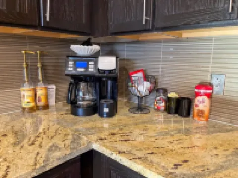 Cozy Retreat with Rooftop Pool, Parking, and Spacious Comfort