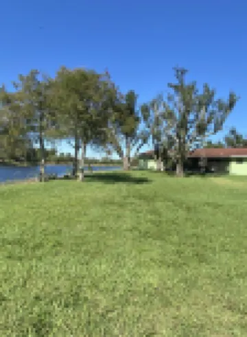 beautiful home on a 3 acre lake with security