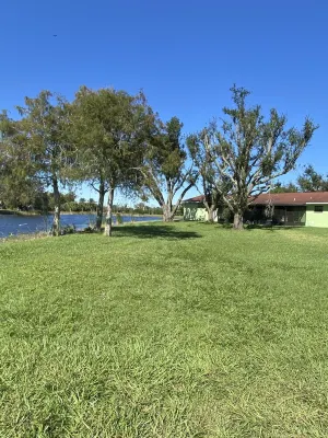 beautiful home on a 3 acre lake with security