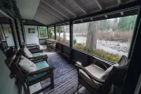 Riverside Mid-Century Cabin with Mountain Views