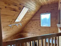 Close to Beach and Town of Souris. Quaint cottage with lovely log cabin feel. Hotels in Kings County