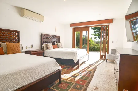 Tropical Golf View Villa. Steps to the ocean with a Gym and Theater-game room.