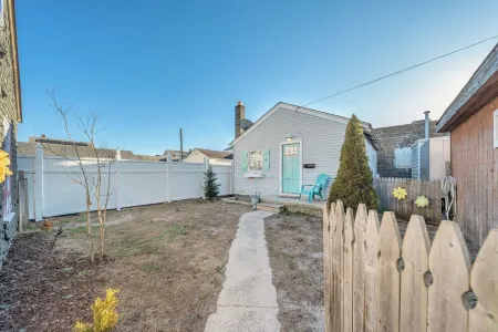 Walk to the beach or Sunset Lake with a front yard and Pet-Friendly!