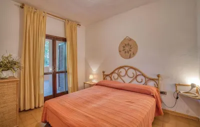 Beautiful bay of white sand and clear sea opposite the island Tavolara Hotels near Porto Istana Beach