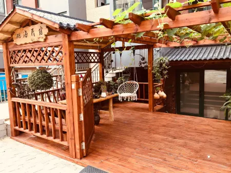 Xingcheng Guanhai Homestay Отели рядом с достопримечательностью «Three Reef Range Rover»