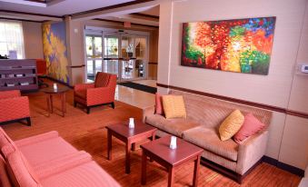 a well - decorated living room with multiple couches and chairs , creating a comfortable and inviting atmosphere at Courtyard Middlebury