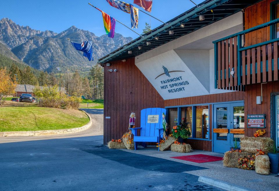 a building with a blue mailbox on the front and colorful flags hanging from the eaves at Fairmont Hot Springs Resort