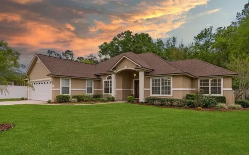 Four-bedroom mini estate, minutes from downtown Jax with a sunroom and backyard