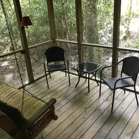Come to the mountains to a rustic cabin by a creek.